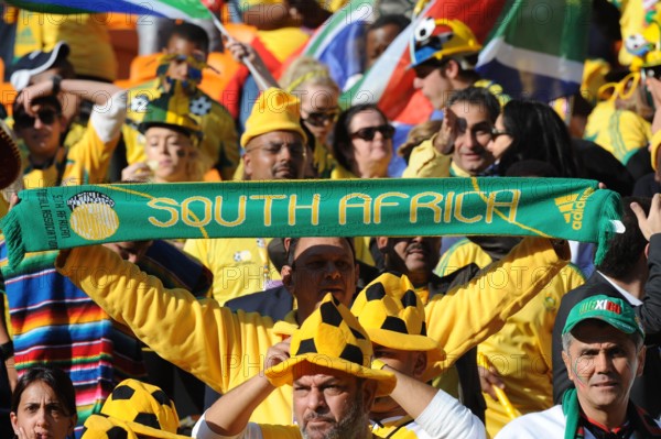 Fans celebrate during the opening ceremony of the 2010 FIFA World Cup at Soccer City stadium in Johannesburg, South Africa 11 June 2010. Photo: Achim Scheidemann dpa - Please refer to http://dpaq.de/FIFA-WM2010-TC