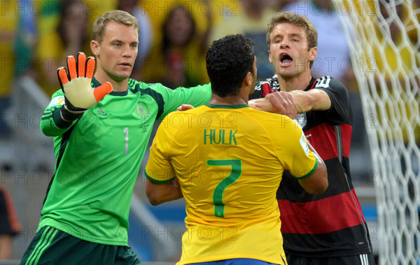 Germany's goalkeeper Manuel Neuer (L), Thomas Mueller, and Brazil's Hulk (C) argue with each other during the FIFA World Cup 2014 semi-final soccer match between Brazil and Germany at Estadio Mineirao in Belo Horizonte, Brazil, 08 July 2014. Photo: Thomas Eisenhuth/dpa (RESTRICTIONS APPLY: Editorial Use Only, not used in association with any commercial entity - Images must not be used in any form of alert service or push service of any kind including via mobile alert services, downloads to mobile devices or MMS messaging - Images must appear as still images and must not emulate match action video footage - No alteration is made to, and no text or image is superimposed over, any published image which: (a) intentionally obscures or removes a sponsor identification image; or (b) adds or overlays the commercial identification of any third party which is not officially associated with the FIFA World Cup) EDITORIAL USE ONLY ++