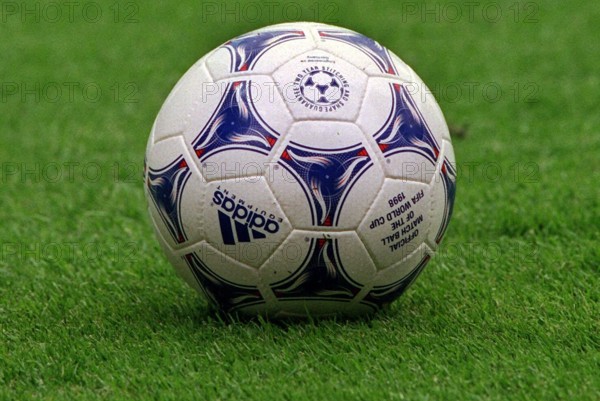 The official ball for the 16th soccer world cup lies on the pitch in the stadium in Lens, France, 12 June 1998. Three decades after the invention of colour television it was the first time that there was a coloured ball. It was painted in the French national colours: red, white and blue - hence its name: Tricolore.