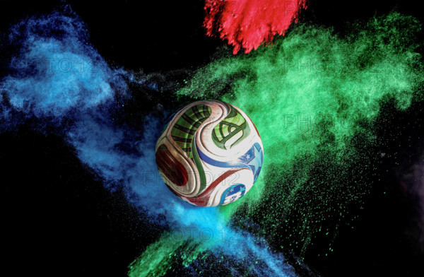 firo : 07.12.2025 Soccer, Soccer, WORLD CUP 2026 World Cup match ball called the 2026 World Cup in the USA, Canada, and Mexico, called Trionda Pro by Adidas, photographed in the studio with Holi colored powder GENERAL SYMBOL IMAGE BACKGROUND LAYER (c) WO