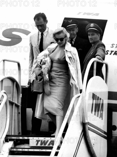 Marilyn Monroe and her husband Arthur Miller arrive at London airport. 14th July 1956
