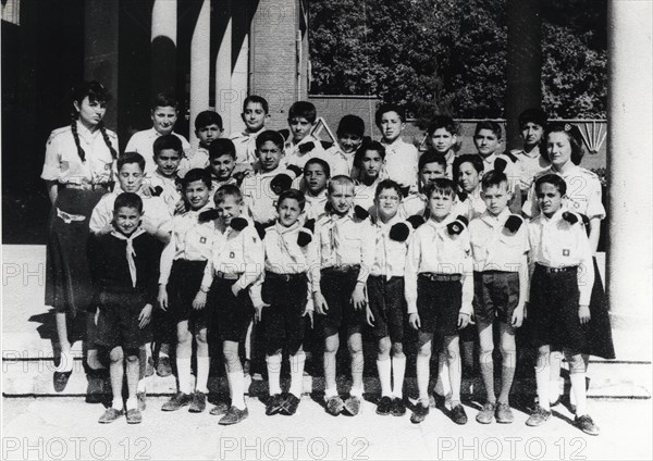 Farah Diba with her troop of young scouts. On the right, Elli Antoniades