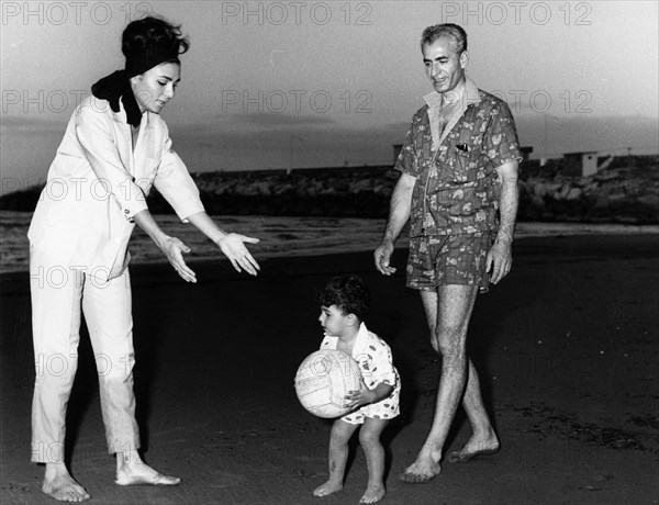 Farah and Mohammed Reza Shah Pahlavi with their son Reza. Caspian Sea. 1963.