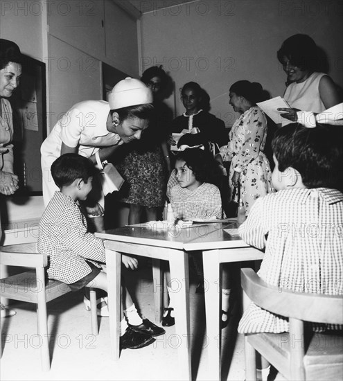 Farah Pahlavi visiting a school in Tehran. 1969