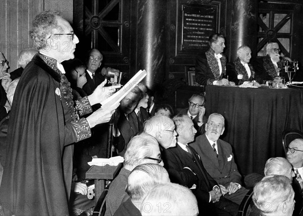 Cocteau delivering a speech at the Académie Française, 1955