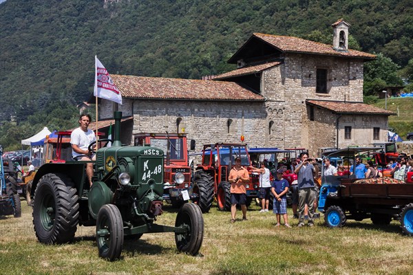 Old Tractor at a gathering of vintage vehicles.