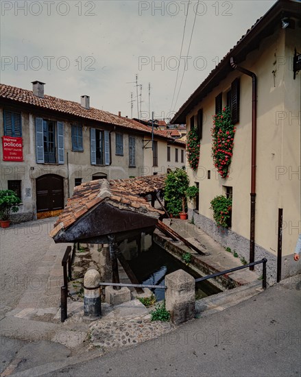 Old washhouse on a street in Milan