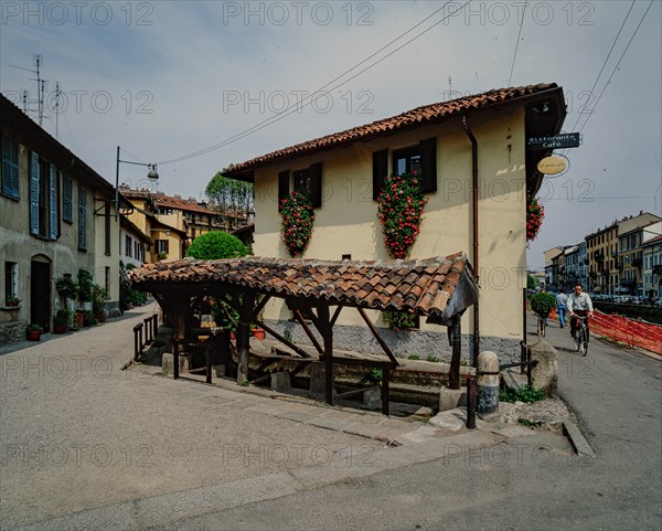 Old washhouse on a street in Milan