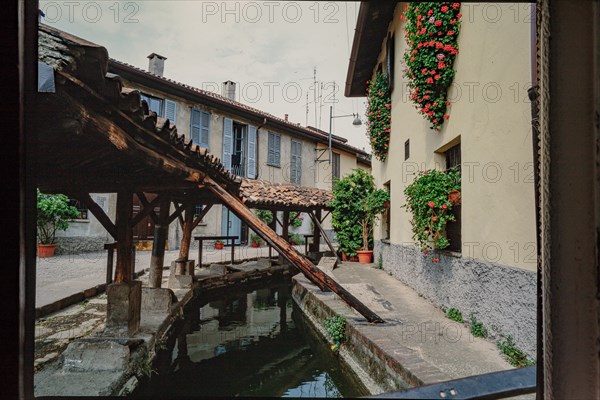 Old washhouse on a street in Milan