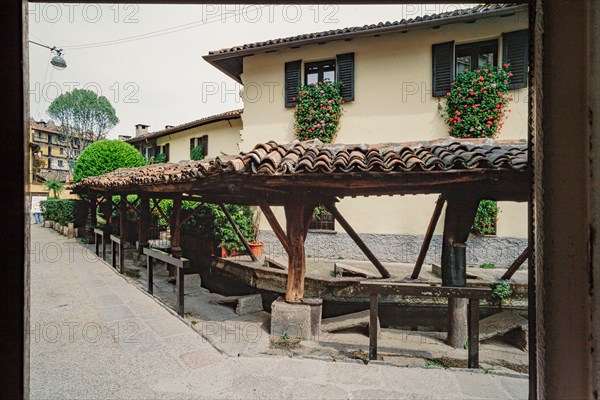 Old washhouse on a street in Milan