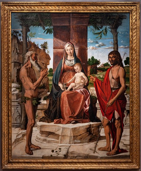 “Madonna with infant Jesus under a pergola among Saints John the Baptist and Onuphrius”, by Bartolomeo Montagna