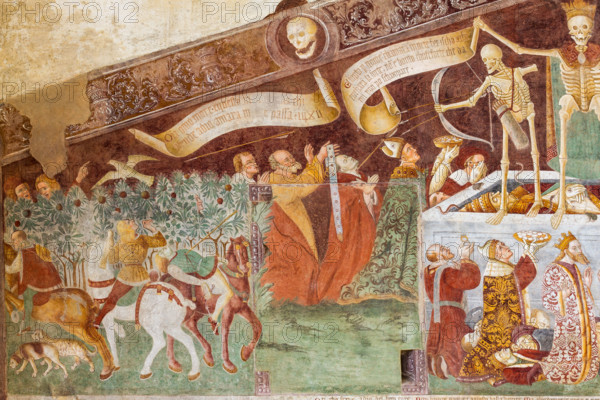 Clusone, Oratorio dei Disciplini o di San Bernardino, facciata: affreschi  "Trionfo della Morte" (parte alta) e "Danza Macabra" (parte bassa), 1485. Opera dell'artista clusonese Giacomo Borlone De Buschis.
Dettaglio del Trionfo della Morte: La Morte si trova sopra un sarcofago al cui interno si trovano ormai privi di vita il Papa e l’Imperatore con intorno serpenti, rospi e scorpioni (simboli di superbia e morte improvvisa). La Morte tiene in mando grossi cartigli che ricordano che  tutti sono destinati a lasciare il mondo terreno.

[ENG] 
Clusone, Oratory of Disciplini or St. Bernardino, façade: frescoes with the Triumph of Death on the top and a Dance of Death (Macabre Dance) in the lower register (1485). All the frescoes are by Giacomo Borlone De Buschis.
Detail of the Triumph of Death standing on a sarcophagus where the dead Pope and the Emperor lie. Theay are surrounded by serpents, scorpions and toads (symbols of pride and sudden death). Death hold big scrolls to remind ever...