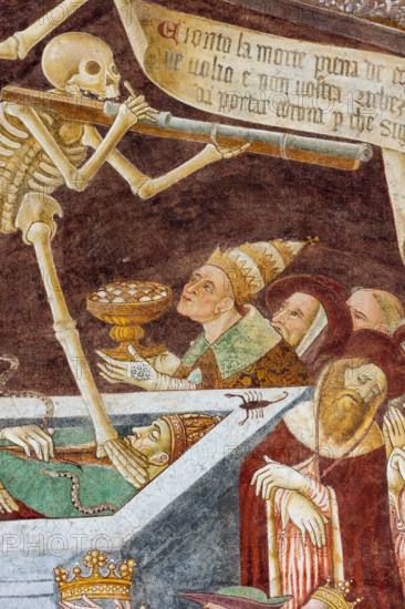 Clusone, Oratorio dei Disciplini o di San Bernardino, facciata: affreschi  "Trionfo della Morte" (parte alta) e "Danza Macabra" (parte bassa), 1485. Opera dell'artista clusonese Giacomo Borlone De Buschis.
Dettaglio del Trionfo della Morte: La Morte si trova sopra un sarcofago al cui interno si trovano ormai privi di vita il Papa e l’Imperatore con intorno serpenti, rospi e scorpioni (simboli di superbia e morte improvvisa). La Morte tiene in mando grossi cartigli che ricordano che  tutti sono destinati a lasciare il mondo terreno.

[ENG] 
Clusone, Oratory of Disciplini or St. Bernardino, façade: frescoes with the Triumph of Death on the top and a Dance of Death (Macabre Dance) in the lower register (1485). All the frescoes are by Giacomo Borlone De Buschis.
Detail of the Triumph of Death standing on a sarcophagus where the dead Pope and the Emperor lie. Theay are surrounded by serpents, scorpions and toads (symbols of pride and sudden death). Death hold big scrolls to remind ever...