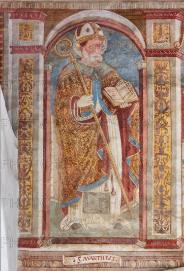 Clusone, Chiesa di San Defendente, affreschi sotto la lunetta del portale: San Martino.

[ENG] 
Clusone, Church of St. Defendens, frescoes under the porch lunette: St. Martin.
Clusone (BG), Lombardia - Lombardy, Italia - Italy