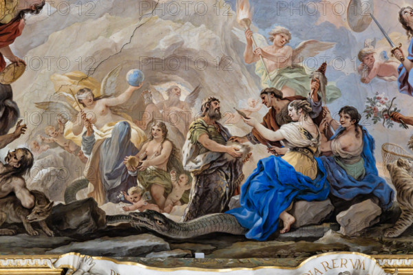 Medici Riccardi Palace, Gallery of Mirrors (or Room Luca Giordano), detail of the vault: "the Cave of Eternity and the Birth of Man".
Frescoes by Luca Giordano; 1682 - 1685.

A group of divinities attends the birth of man, symbolized by the newborn held in the hand of the two-faced god Janus at the centre of the scene. The whole group is surrounded by an ouroboros (snake biting its own tail), symbol of Eternity, while in the background inside a cave is Time (represented by the figure of an elderly winged man with an hourglass in his hand). In front of them is a veiled goddess (perhaps Necessity) who offers a rod to Fortune (portrayed blindfolded) and a golden sphere to Nature (from which milk flows from the breast). Next to the god Janus are the three Fates with the thread (to be worked) of human life.
Palazzo Medici Riccardi, Firenze (FI) - Florence, Toscana - Tuscany, Italia - Italy