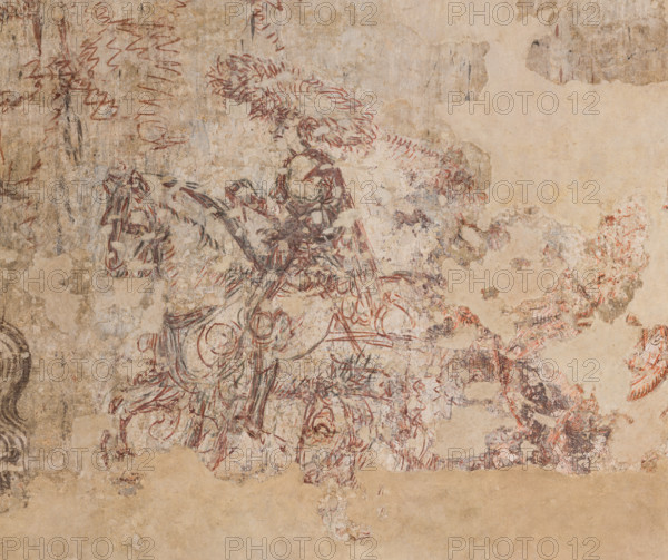 Ducal Palace, Hall of the Popes, south-east wall: “Tournament of Knights” or “Tournament-Battle of Louvezerp”, 1430-1433, by Antonio di Puccio, known as Pisanello. Sinopia relating to the wall painting of the Pisanello room, the subject is taken from “Le roman en prose de Tristan”, a masterpiece of chivalric literature. Detail of an extravagantly dressed knight. The very wide brimmed headdress is very peculiar.
Palazzo Ducale, Mantova (MN) - Mantua, Lombardia - Lombardy, Italia - Italy