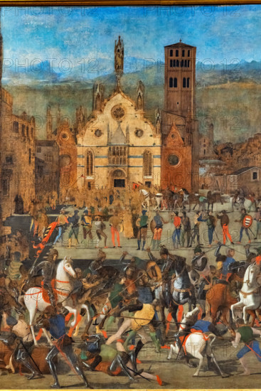“The Expulsion of the Bonacolsi”, by Domenico Moroni, egg tempera on canvas, 1494.

The painting was commissioned to Domenico Morone by the fourth Marquis of Mantua, Francesco II Gonzaga. It illustrates the victorious battle that Luigi I Gonzaga fought in Mantua on August 16, 1328, against Rinaldo Bonacolsi for possession of the city.
The work depicts both the raging battle in the main square (now Piazza Sordello), as recounted by ancient chroniclers, and the city's architecture as it appeared at the time Morone painted it, with its towers, palaces, and square. In the background. in the center, Mantua Cathedral appears, with its late-Gothic façade by the Venetian architect Jacobello dalle Masegne, adorned with sculptures by his brother Pierpaolo and Giacomino da Pavia.
Palazzo Ducale, Mantova (MN) - Mantua, Lombardia - Lombardy, Italia - Italy