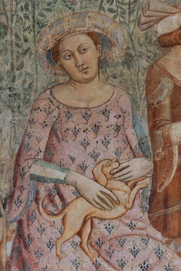 Pisa, Camposanto monumentale: ”Trionfo della Morte”, particolare degli affreschi di Buonamico Buffalmacco, 1336/1341. A sinistra, dettaglio con anime di morti di peste afferrate da diavoli. A destra, particolare di scena cortese: “I dieci giovani nel verziere”.  Giovane donna con cane.

[ENG]
Pisa, Monumental Cemetery: "Triumph of Death," detail of the frescoes by Buonamico Buffalmacco, 1336/1341. On the left, a detail of the souls of plague victims being seized by devils. On the right, a detail of a courtly scene: "The Ten Youths in the Garden."  Young woman with dog.
Camposanto Monumentale, Pisa (PI), Toscana - Tuscany, Italia - Italy