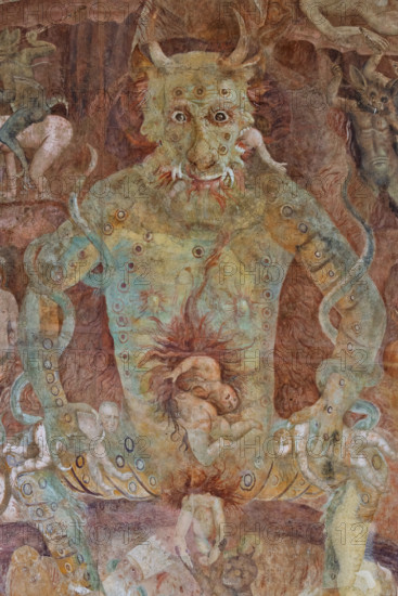 Pisa, Monumental Cemetery: “Hell”; detail with “Lucifer,” a gigantic figure twice the size of Christ the Judge. Lucifer represents pride, the root of all vice. The damned soul devoured by Lucifer is Judas Iscariot, mangled in the monster’s central mouth. Lucifer also devours Brutus and Cassius in the lateral mouths. Judas is considered the supreme traitor for betraying Christ, while Brutus and Cassius betrayed Julius Caesar, considered a benefactor and symbol of the Empire.
 Frescoes by Buonamico Buffalmacco, 1336/1341.
Camposanto Monumentale, Pisa (PI), Toscana - Tuscany, Italia - Italy