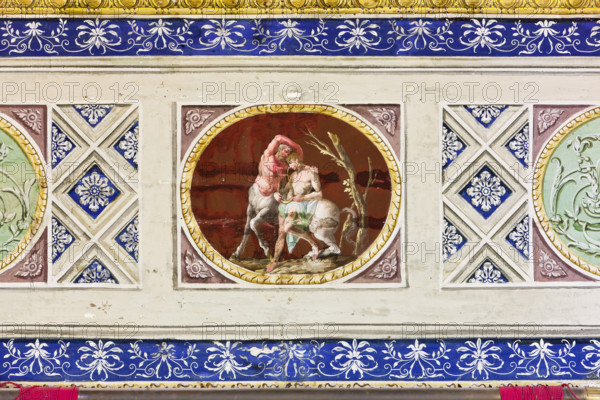 Palermo, Palazzo Reale o Palazzo dei Normanni, Appartamento Reale, Sala Rossa, la volta: particolare decorativo con cameo di satiro e centauro.

[ENG]
Palermo, The Royal Palace or Palazzo dei Normanni (Palace of the Normans), The Royal Apartment, The Red Room: detail of the decoration depicting a cameo with a satyr and a centaur.
Palazzo Reale (Palazzo dei Norma, Palermo (PA), Sicilia - Sicily, Italia - Italy