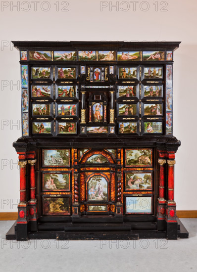 Palermo, Palazzo Reale o Palazzo dei Normanni, Appartamento Reale, Stanza del Monetiere (accanto al Gabinetto Cinese):   il Monetiere stipo in legno con impiallacciatura in ebano, e intarsi in tartaruga, lacche rosse e bronzo dorato. Pannelli in vetro dipinto con scene bibliche, mitologiche e allegoriche. Ebanisti siciliani, sec XVII.

[ENG]
Palermo, The Royal Palace or Palazzo dei Normanni (Palace of the Normans), The Royal Apartment, The Monetiere Room (next to the Chinese Room): the Monetiere, i.e. the wooden cabinet with an ebony veneer, and inlays in tortoise, red lacquers and gilded bronze. Painted glass panels with biblical, mythological and allegorical scenes. Sicilian cabinetmakers, XVII century.
Palazzo Reale (Palazzo dei Norma, Palermo (PA), Sicilia - Sicily, Italia - Italy