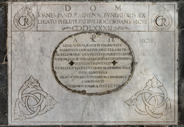 Il Tempietto del Santo Sepolcro, monumento funebre di Firenze, conservato nella cappella del Santo Sepolcro che è l'unica parte ancora consacrata della ex-chiesa di San Pancrazio. 
Particolare di un’iscrizione con dedicazione del tempesto.
Nel tempietto è sepolto Giovanni di Paolo Rucellai e l'architettura è opera di Leon Battista Alberti. La forma del tempietto, che fu costruito tra il 1457 e il 1467,  è ispirata, in scala, al Santo Sepolcro di Gerusalemme. Le tarsie marmoree della decorazione esterna si rifanno alla tradizione romanica fiorentina.

[ENG]
The Small Temple of the  Holy Sepulchre, a funerary monument in Florence, housed in the Chapel of the Holy Sepulchre, the only remaining consecrated part of the former church of San Pancrazio.
Detail of an inscription with the dedication of the small temple.
Giovanni di Paolo Rucellai is buried in the temple, and the architecture is by Leon Battista Alberti. It was built between 1457 and 1467. The temple's shape is inspired, i...