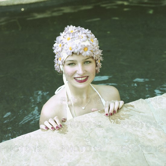 Woman in Pool Wearing Floral Cap