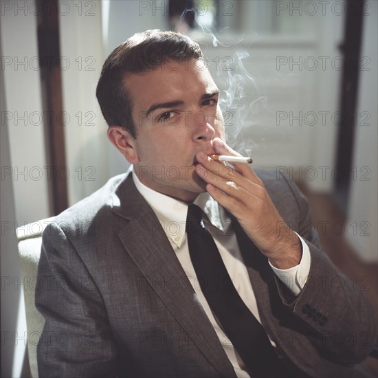 Sharp Dressed Man Smoking Cigarette