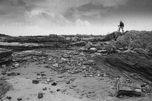 Young Boy on Rocky Landscape