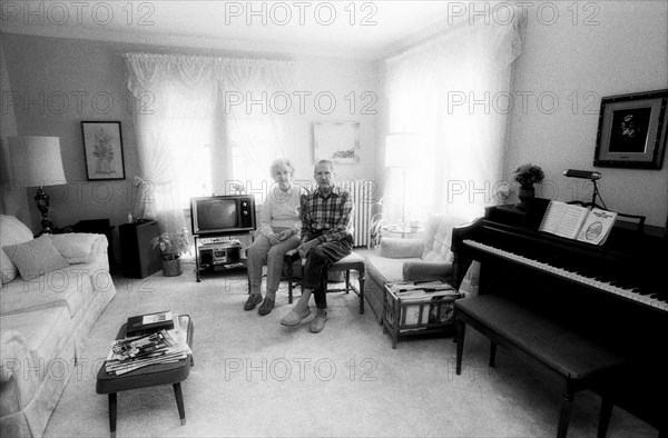 Eldery Couple Sitting and Holding Hands