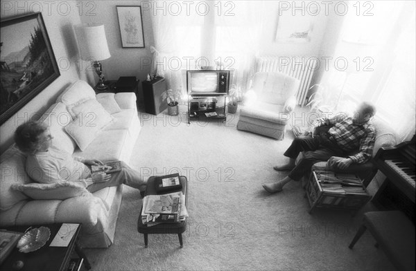 Elderly Couple Sitting in Living Room