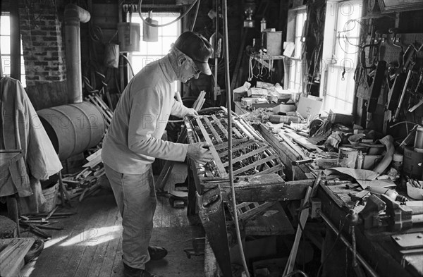 Lobsterman Repairing Traps, Maine, USA