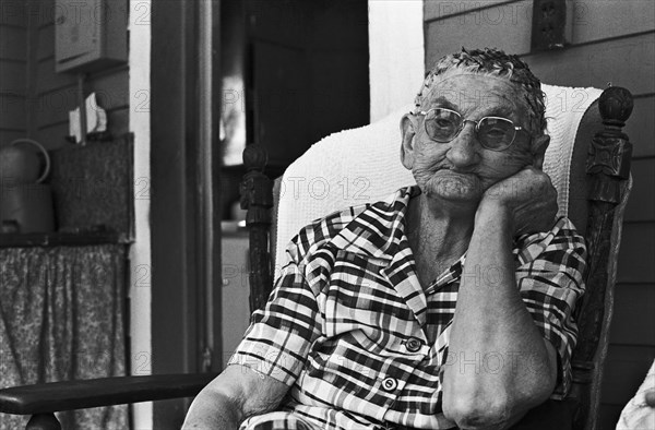 Bored Elderly Woman Sitting on Porch