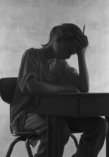 Pensive Student at Desk