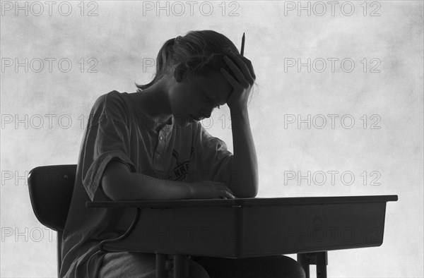 Pensive Student at Desk