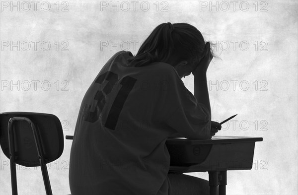 Pensive Student at Desk