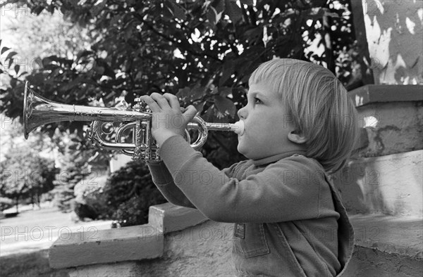 Young Boy Playing Trumpet