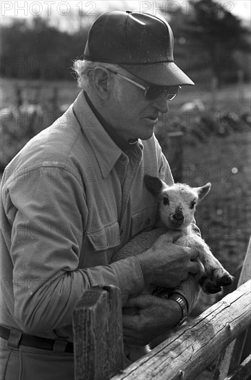 Farmer Holding Lamb