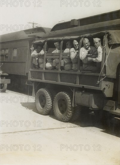 Group of Soldiers on Truck, Awaiting Departure for East Coast USA with Eventual Departure by Ship to Europe, WWII, 2nd Battalion, 389th Infantry, US Army Military Base, Indiana, USA, 1942