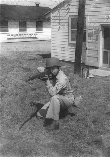 Soldier Displaying Proper Shooting Position During Training Session, WWII, 2nd Battalion, 389th Infantry, US Army Military Base Indiana, USA, 1942