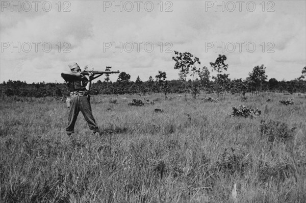 Soldier Displaying Proper Shooting Position in Field During Training Session, WWII, 2nd Battalion, 389th Infantry, US Army Military Base Indiana, USA, 1942