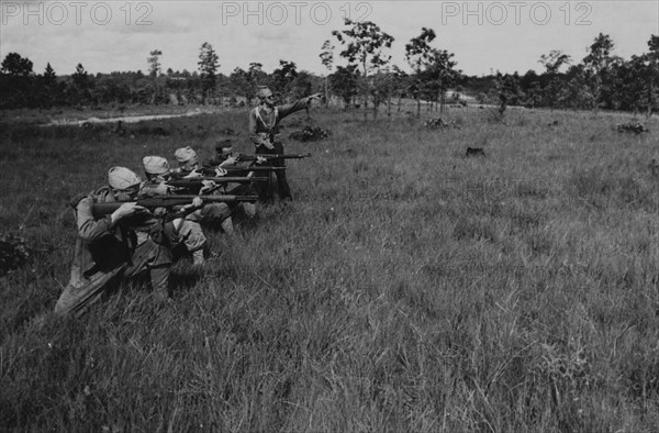 Group of Soldiers Displaying Proper Shooting Position in Field During Training Session, WWII, 2nd Battalion, 389th Infantry, US Army Military Base Indiana, USA, 1942