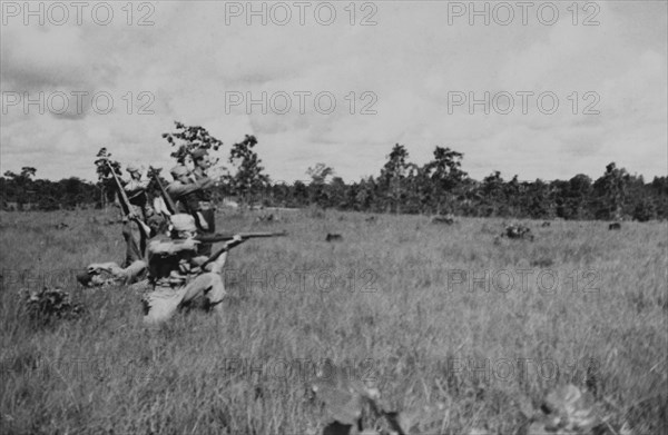 Group of Soldiers Displaying Proper Shooting Position in Field During Training Session, WWII, 2nd Battalion, 389th Infantry, US Army Military Base Indiana, USA, 1942