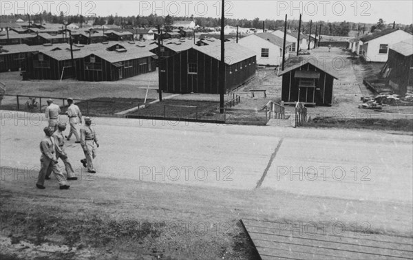 Group of Soldiers Walking Near Military Barracks, WWII, 2nd Battalion, 389th Infantry, US Army Military Base Indiana, USA, 1942