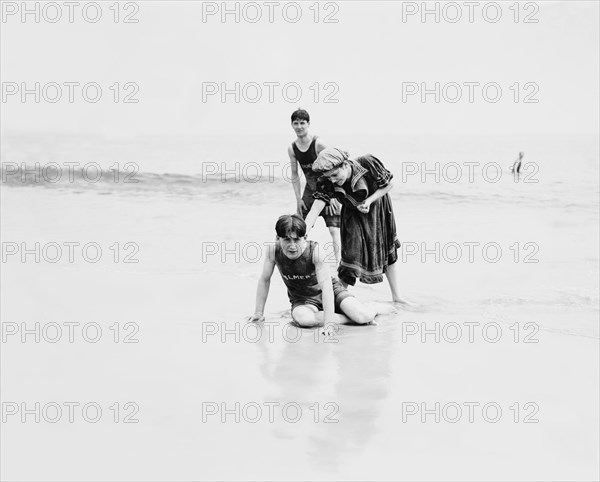 Two Young Men and Woman Having Fun at Beach, Coney Island, New York, USA, Detroit Publishing Company, 1900