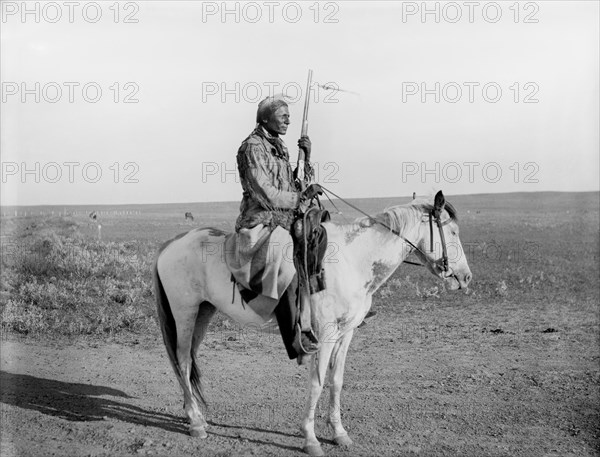 Rattlesnake, an Assiniboine, on guard on Outskirts of Camp, Fort Belknap, USA, Detroit Publishing Company, 1907