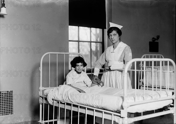 Nurse Checking Child's Pulse in Hospital, Portrait, Harris & Ewing, 1915