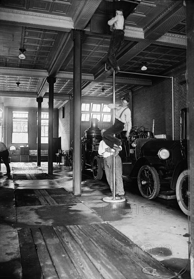 Firemen Sliding down Pole in Firehouse, USA, Harris & Ewing, 1922