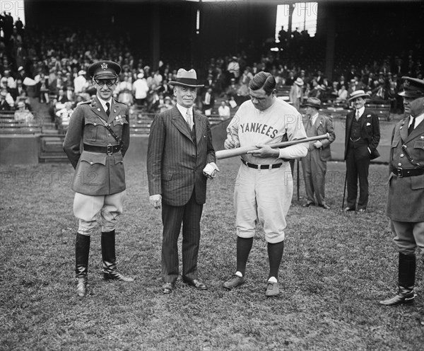 Secretary of War James W. Good Watching Babe Ruth of New York Yankees Signing First of Many Bats to be Awarded as Prizes at Citizens Military Camps Throughout U.S., Griffith Stadium, Washington DC, USA, Harris & Ewing, May 28, 1929