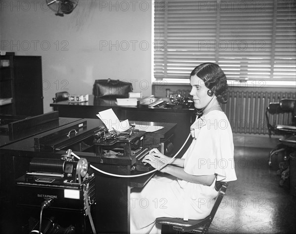Woman Working with Dictaphone and Typewriter in Office, USA, Harris & Ewing, 1932